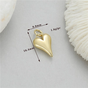 Detailed view of a 14K gold-plated heart pendant with 18.4x9.8mm dimensions