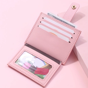 Slim pink lychee faux leather card holder with multiple slots and metal snap closure