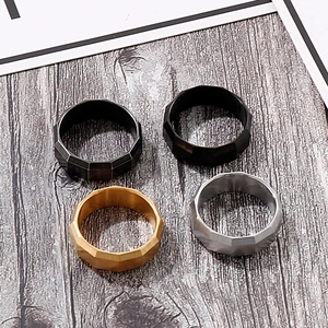 Detail of 8mm brushed punk rings showing geometric cut edges in gold silver black and gunmetal