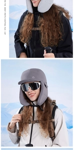 Close-up of a dark grey thermal trapper hat with windproof fabric and extended ear flaps