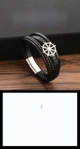 Close-up of nautical rudder charm and multi-layer braided leather bracelet for men