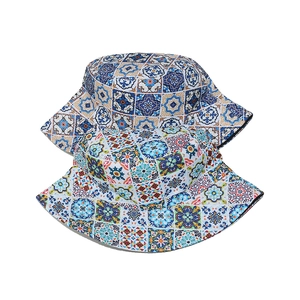 Detailed view of colorful bohemian bucket hats with vintage mandala patterns and geometric prints