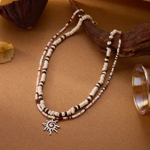 Double-layered beaded necklace with sun pendant, coconut husks and wooden beads style