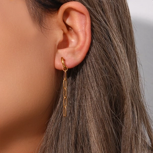Close-up of long paperclip chain drop earrings in 18K gold plated stainless steel