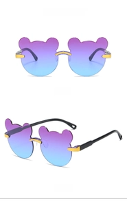 Detail view of bear-shaped sunglasses with purple blue gradient lenses and gold accents