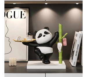 Detail view of panda resin organizer with golden tray for keys and accessories