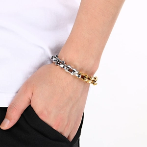 Close-up of industrial style two-tone bone link bracelet in silver and gold polished finish