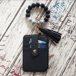 Black leather card holder wristlet with silicone beads and stylish tassel keychain