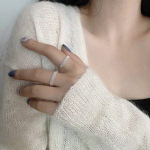 Detail of adjustable S925 sterling silver four-layer beaded rings on model fingers