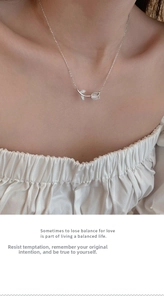 Detail of S925 silver tulip necklace with white chalcedony and micro diamonds on a model