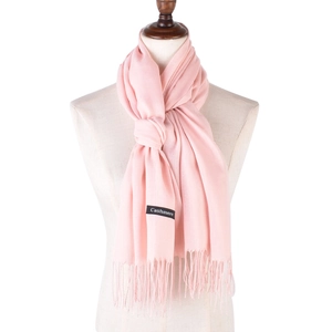 Classic pink faux cashmere scarf with tassels displayed on a mannequin, solid color