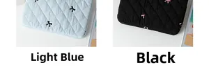 Quilted tablet sleeve details in light blue and black with cute bow embroidery