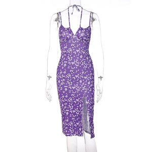 Detail view of purple floral dress featuring thin straps and elegant side slit on a mannequin