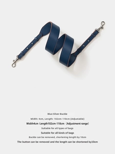 Detail of adjustable 4cm wide navy blue leather bag strap with silver metal lobster clasps