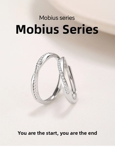 Detailed macro view of Mobius S925 sterling silver couple rings with braided texture and zircon