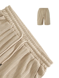 Detail of khaki corduroy texture shorts with elastic waistband and drawstring detail