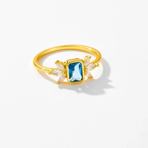 Detail of S925 sterling silver ring featuring a blue emerald-cut gem and white zircons