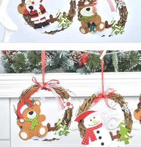 Detail of Christmas rattan wreath ornaments with Santa, Bear, Reindeer and Snowman figures