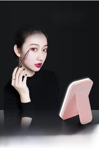 Pink LED makeup mirror with folding stand showing three color temperature modes