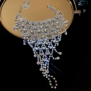 Luxurious mesh water drop tassel bracelet with rhinestones on a mirror surface