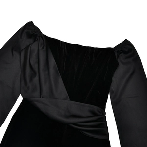 Detail of evening gown featuring black velvet bodice with boning and ruched satin texture