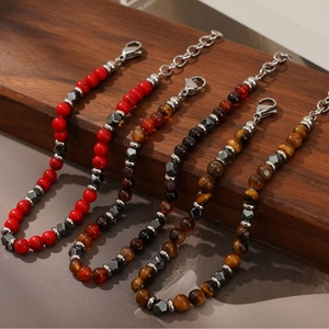 Men's natural stone bead bracelets with tiger eye and agate on a wooden stand