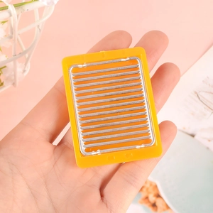 Miniature dollhouse BBQ grill rack with yellow frame and metal rods for DIY kitchen scenes