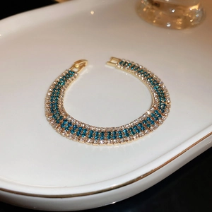 Vintage gold tennis bracelet with three rows of blue and white crystals for women