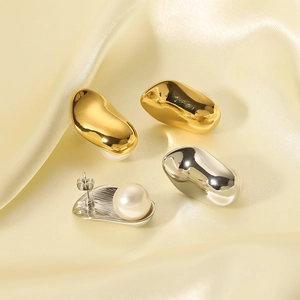 Minimalist 18k gold and silver plated space bean earrings with pearls on silk fabric