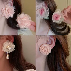 Elegant floral stud earrings set with pink fabric petals and white pearls for women