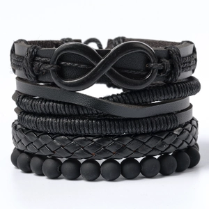 Detail of multi-layer black braided leather bracelet with infinity symbol and matte beads