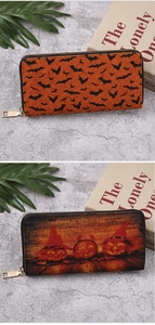 Detail view of Halloween wallets with bat prints and glowing pumpkin patterns