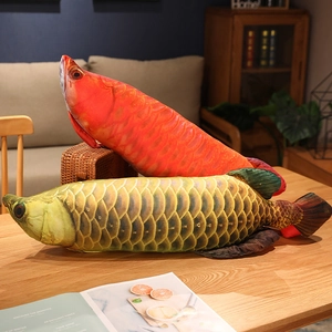 Detailed close-up of soft plush Arowana pillows in red and blue realistic fish print