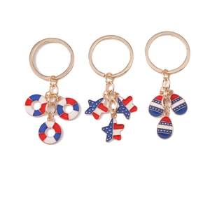 Three keychains with American flag colors including stars and lifebuoy pendants