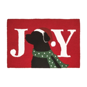Macro shot of Joy Christmas doormat with festive dog pattern and tufted texture