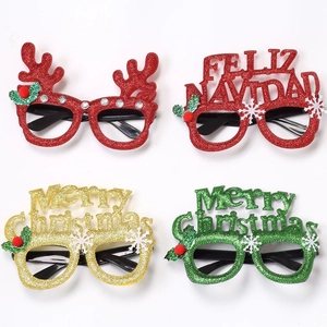 Detailed view of four festive Christmas glasses with glitter deer antlers and holiday text