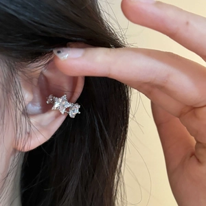 Korean style silver star ear cuff with sparkling zircon crystals worn on ear