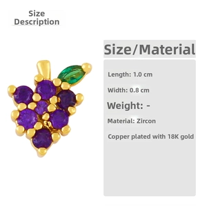 Detail of grape earring with purple zircons and green leaf in 18K gold plated copper