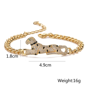 Gold-plated Cuban chain bracelet with a sparkling leopard head design and green eyes