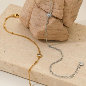 Elegant gold and silver stainless steel anklets with cubic zirconia on natural stone base