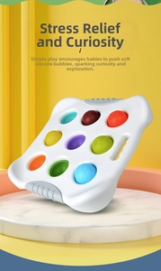 Macro view of baby sensory board with colorful silicone bubbles featuring numbers and letters