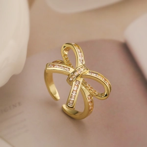 Close-up of 18K gold plated bow ring featuring sparkling zircon stones and open design
