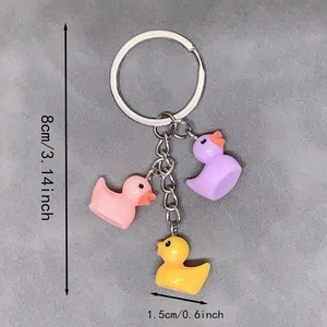 Three colorful resin duck charms on a silver keychain with specific size dimensions