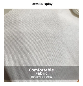 Close-up macro view showing the high-density woven texture of white canvas fabric for tote bags