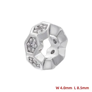 Macro detail of silver hexagonal spacer bead with dimensions 8.5mm by 4.0mm