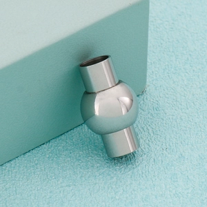 Polished silver magnetic clasp for leather cords featuring geometric stainless steel design