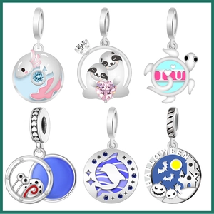 Silver animal charms collection with sloth, salamander, and dolphin in enamel and zircon