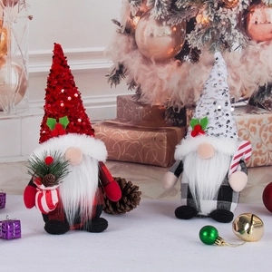 Christmas gnome dolls with red and white sequins in festive holiday interior setting