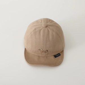 Detail of baby soft brim hat featuring brown puppy embroidery and stitched fabric label