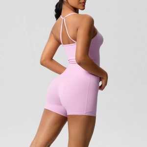 Detail of lavender yoga romper featuring criss-cross back straps and side pockets